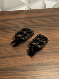 Black foot pegs