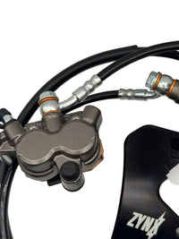 Brake caliper and banjo fittings close-up, ZYNX Yozma IN10 brake kit